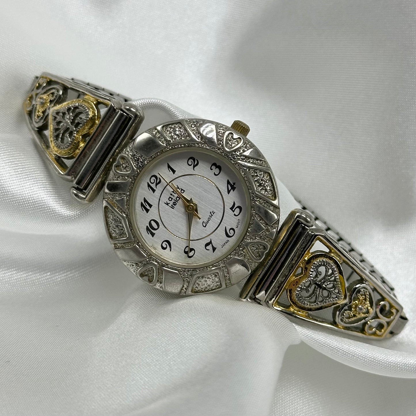 Vintage silver and gold tone hearts watch with quartz movement