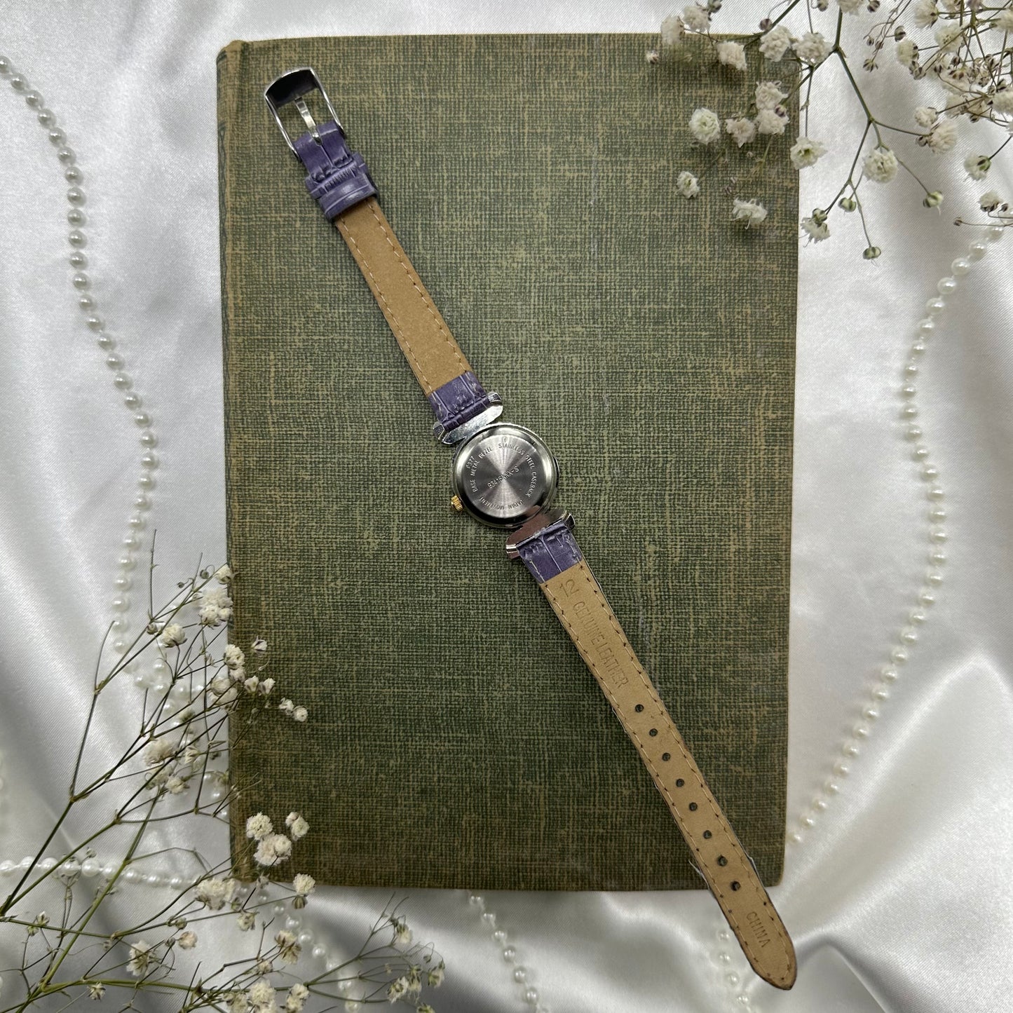 Vintage silver and gold tone watch with purple band
