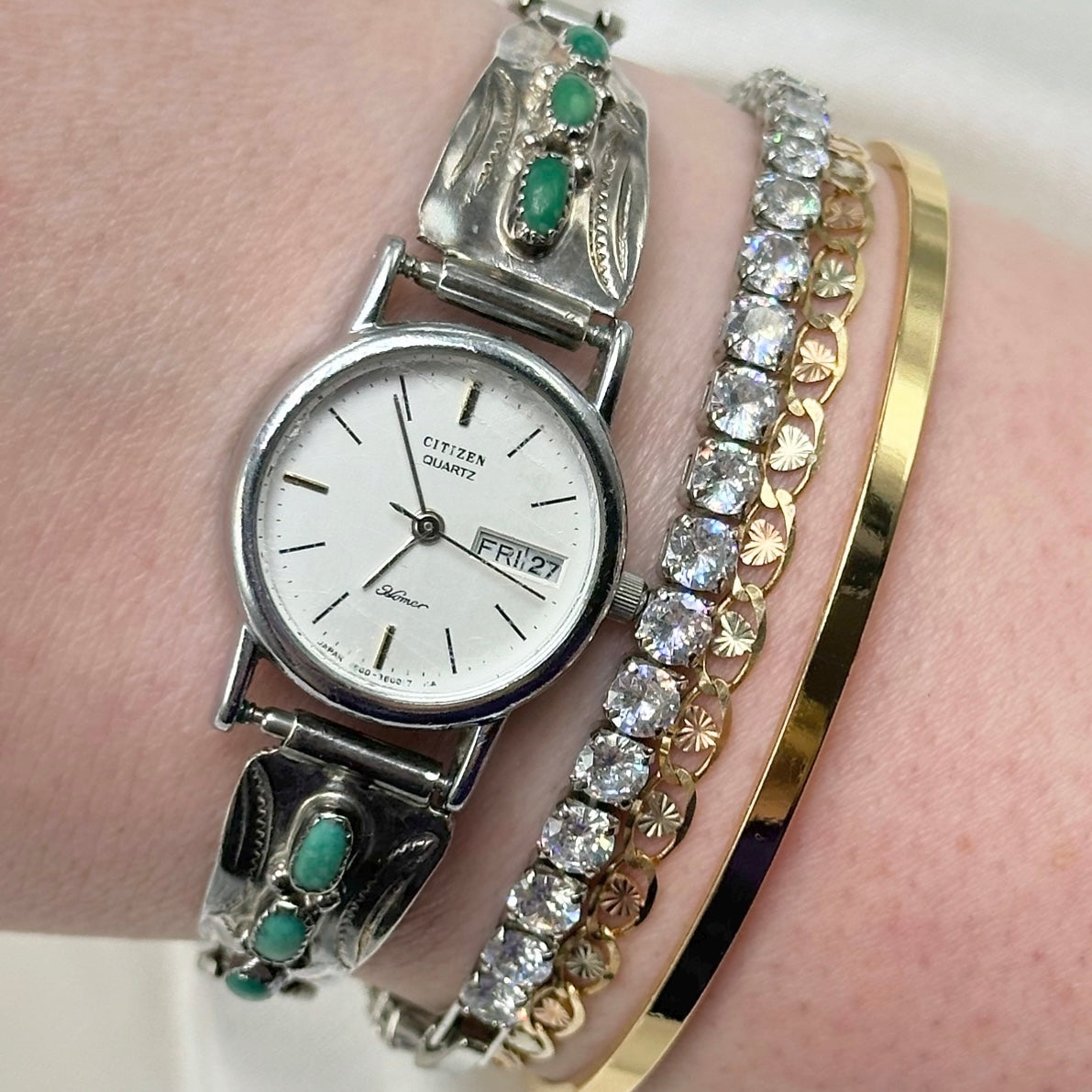 silver tone and turquoise Citizen Homer watch with quartz movement