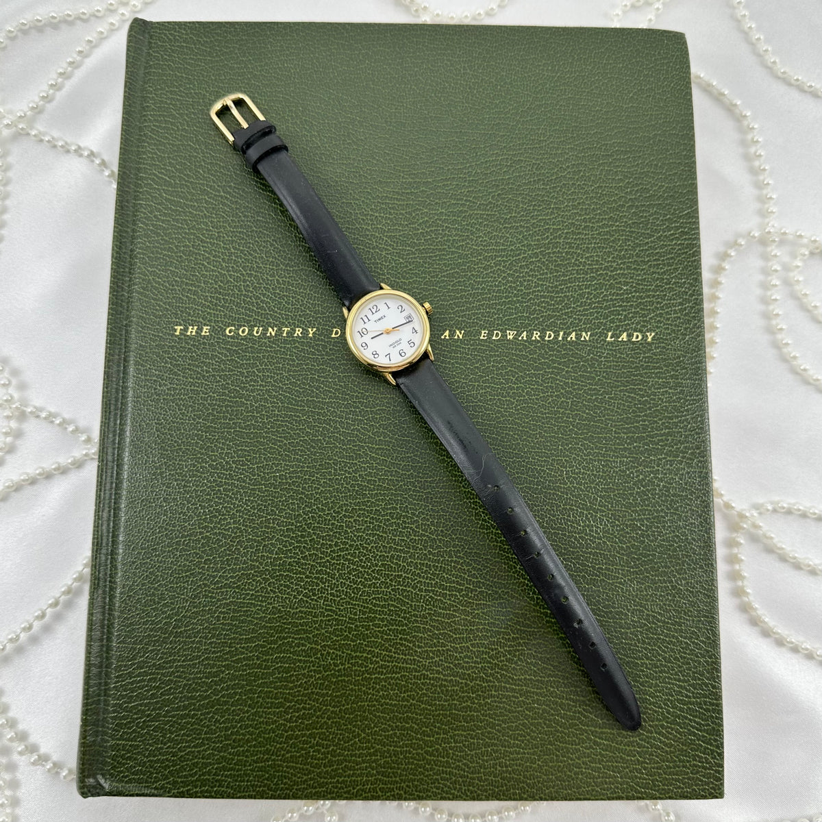 Classic Gold Timex Indiglo Watch with Black Leather Band and Date Display