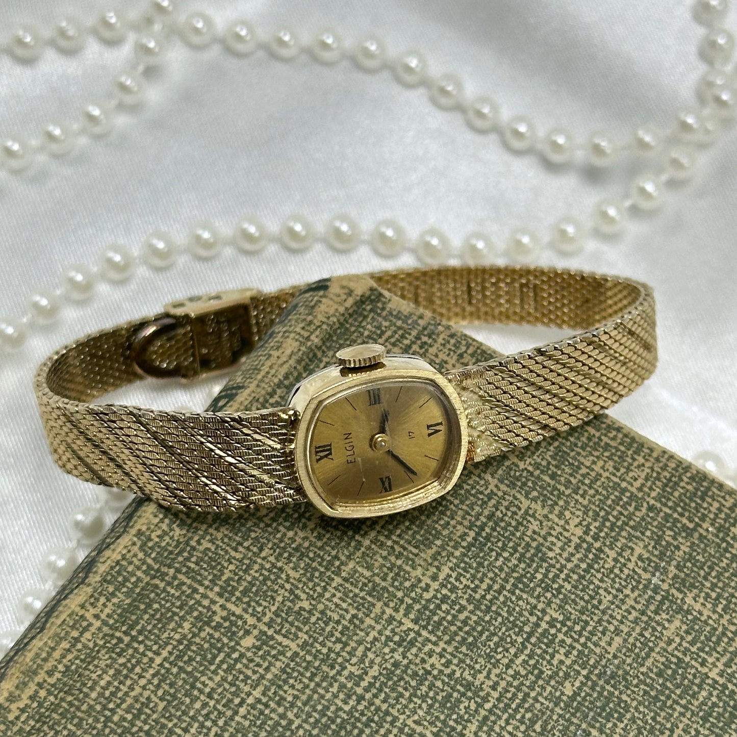 Slender Gold Vintage Wind-Up Elgin Watch with Roman Numeral Markers