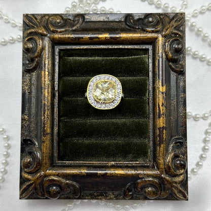 14k gold electroplated vintage deadstock ring with large champagne cubic zirconia stone surrounded by clear cubic zirconia stones.