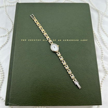 Slender Two-Tone Bulova Watch with Oval Dial