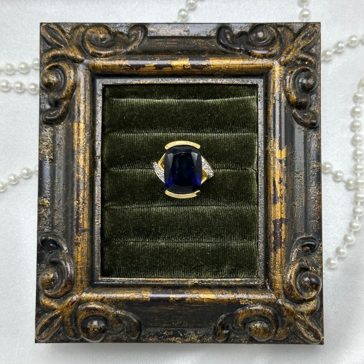 14k gold electroplated vintage deadstock ring with large dark blue cubic zirconia stone.