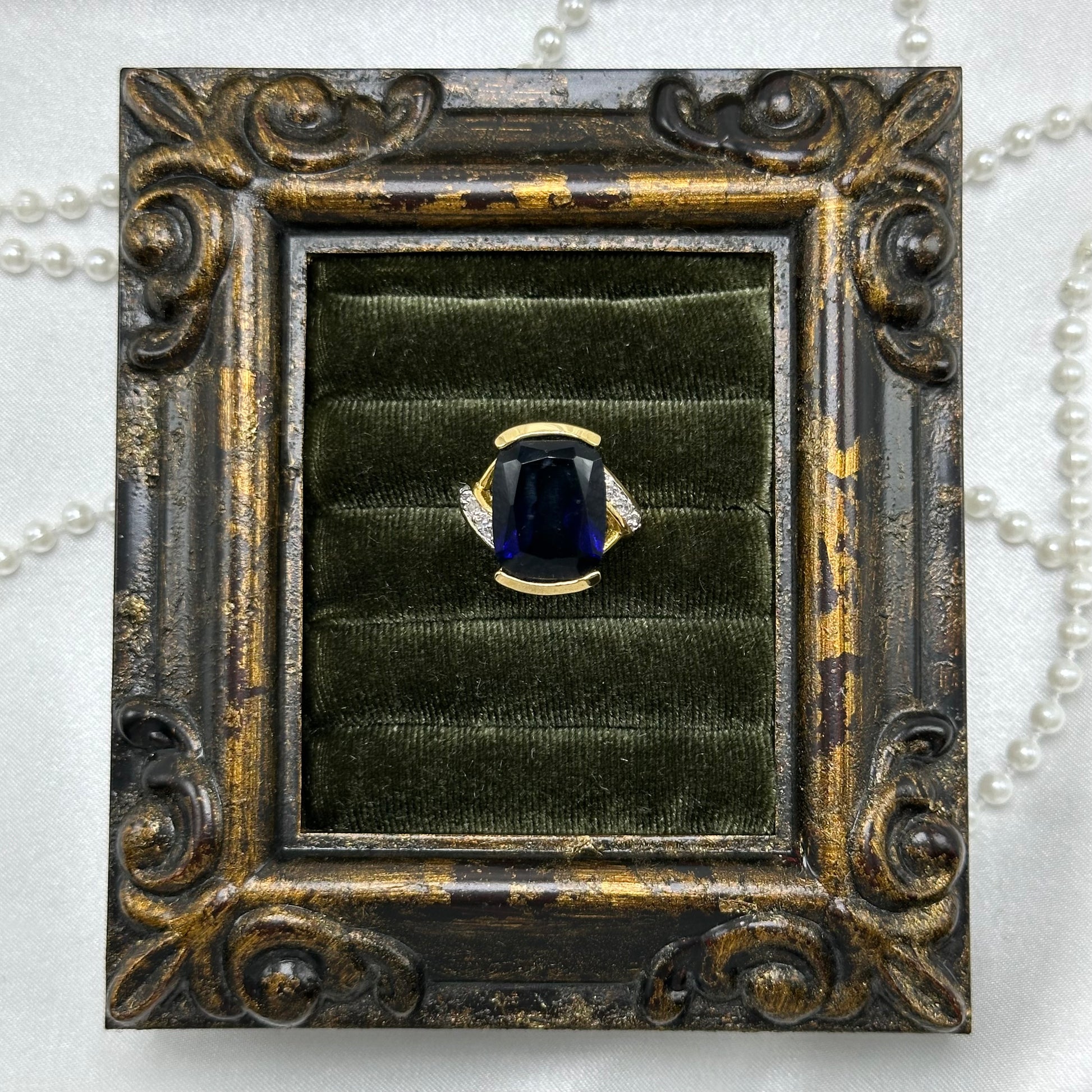 14k gold electroplated vintage deadstock ring with large dark blue cubic zirconia stone.