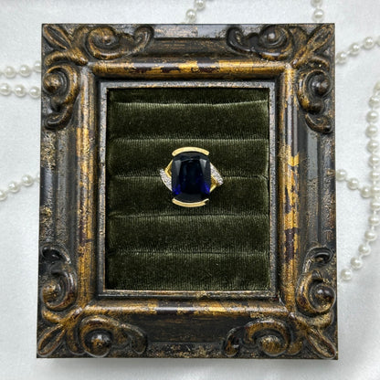 14k gold electroplated vintage deadstock ring with large dark blue cubic zirconia stone.