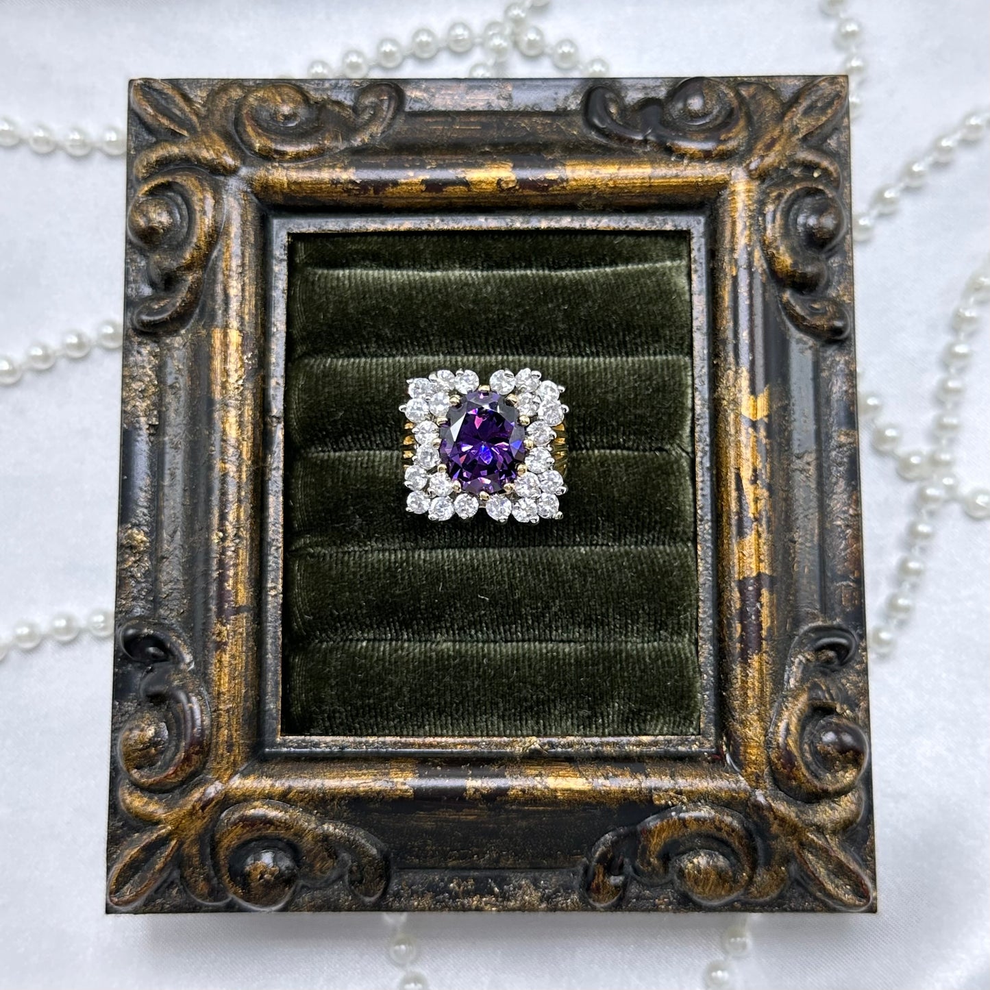 14k gold electroplated vintage deadstock ring with large purple stone and cubic zirconia stones.