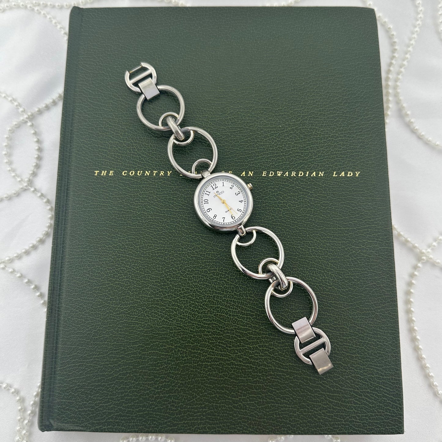 Round Dial Silver Minicci Watch with Gold Hands and Circle Links
