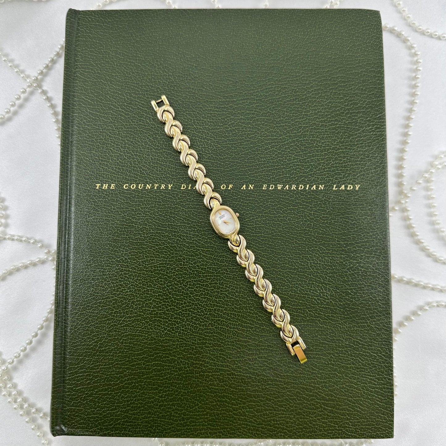 Dainty Gold Citizen Watch with Mother of Pearl Dial