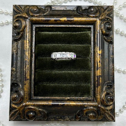 Rhodium plated vintage deadstock infinity band ring with clear rectangular cubic zirconia stones.