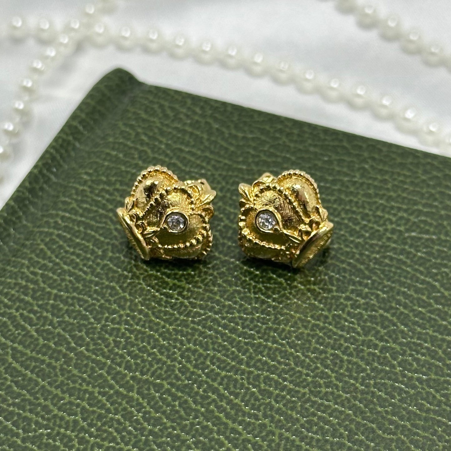 Vintage gold tone Avon regal crown clip on earrings from the 1980's