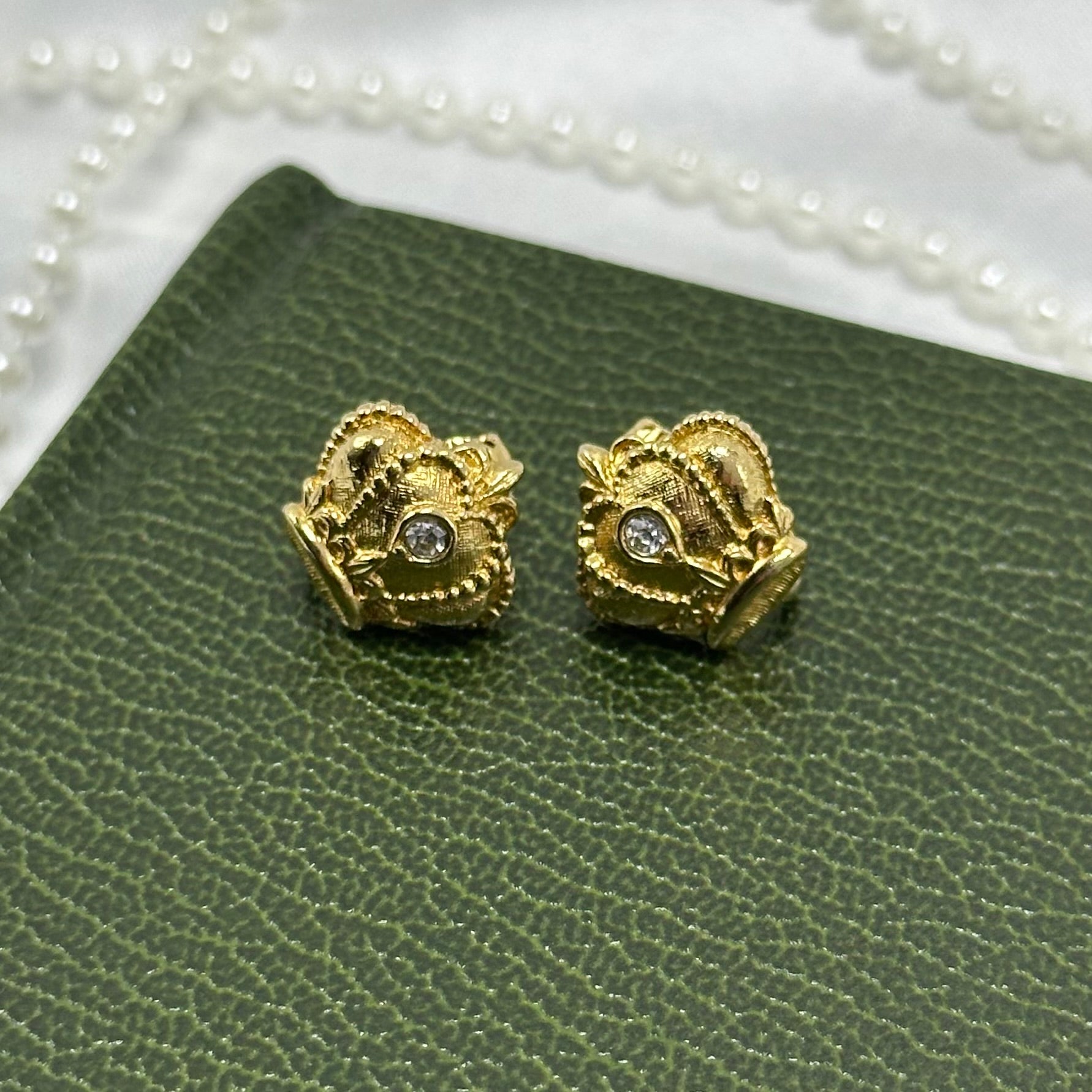 Vintage gold tone Avon regal crown clip on earrings from the 1980's