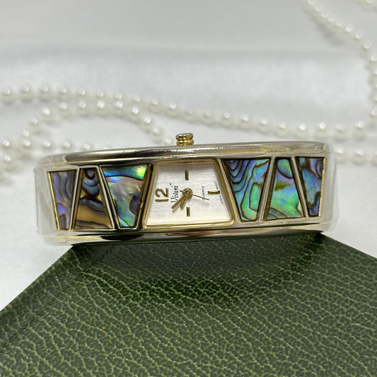 Gold tone cuff Vivani watch with triangle abalone cuff and quartz movement.