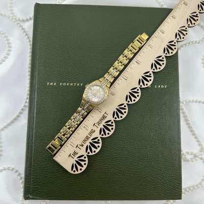 Queen's Court Gold Relic Watch with Crystal Accents and Date Display