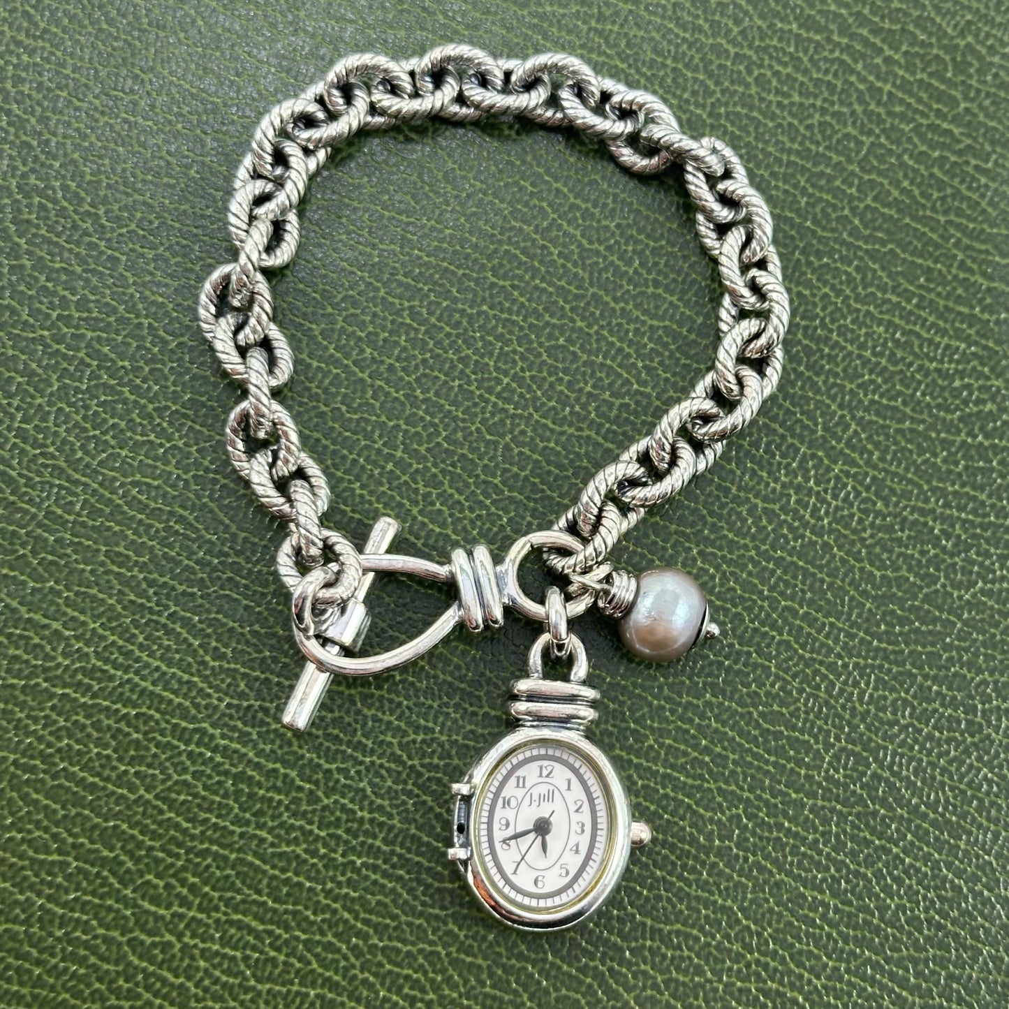 Silver tone J Jill charm bracelet watch with faux gray pearl.