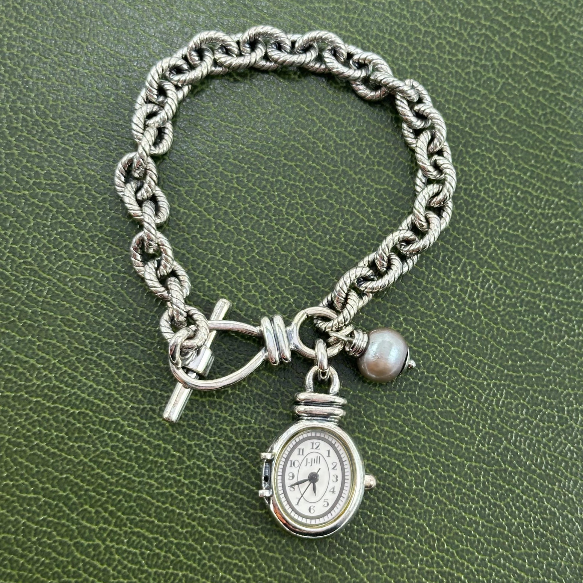 Silver tone J Jill charm bracelet watch with faux gray pearl.