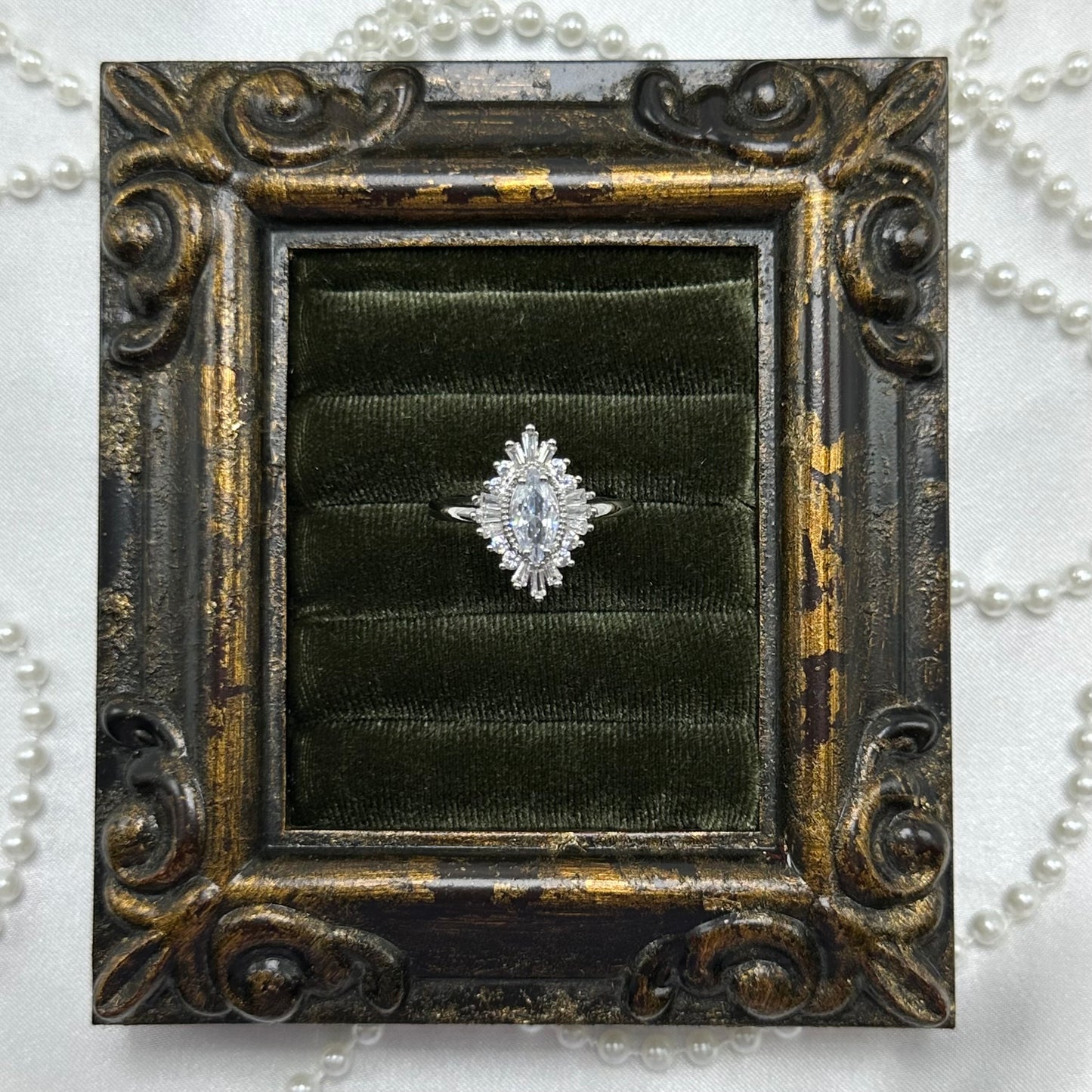 Rhodium plated vintage art deco style silver tone ring with cubic zirconia stones.