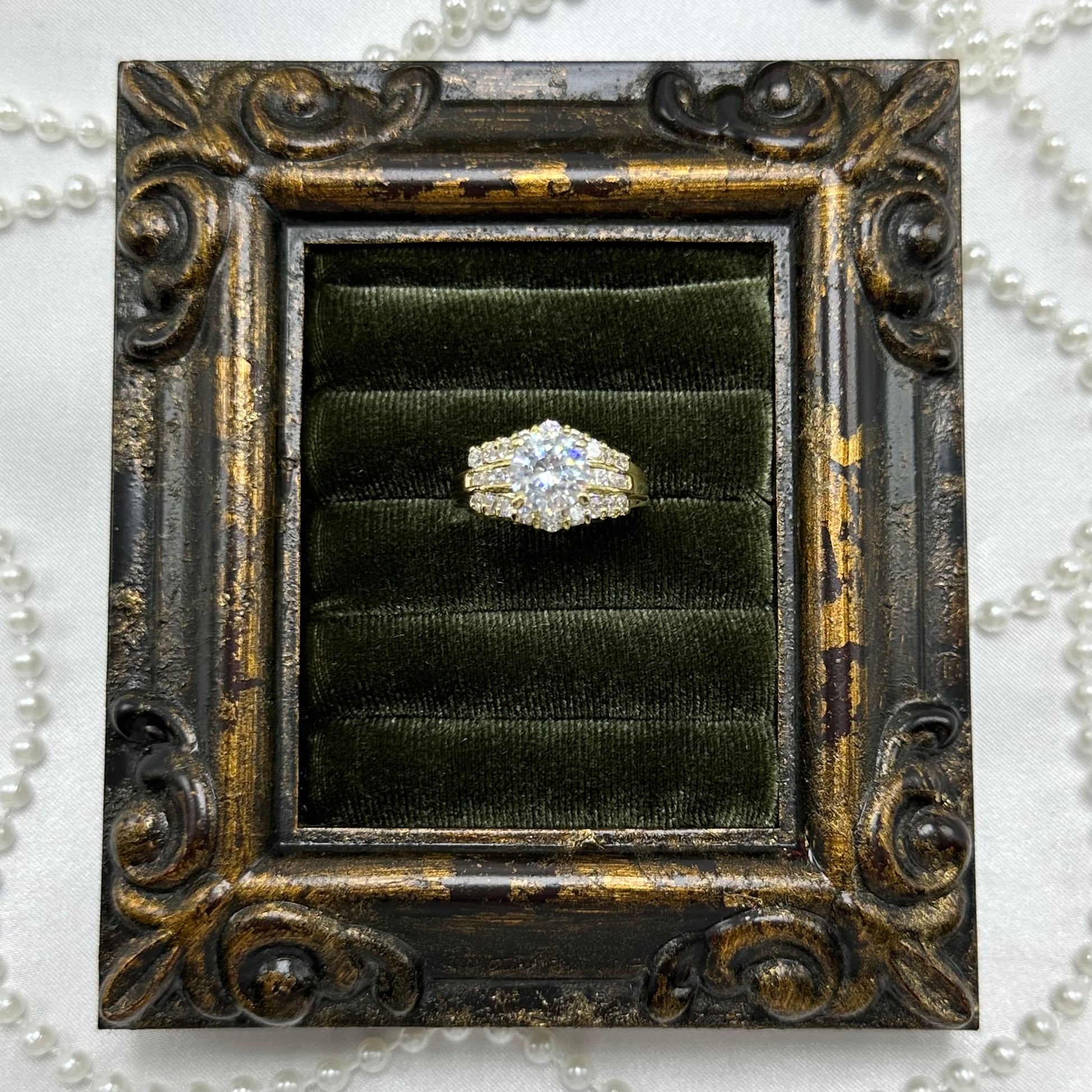 14k gold electroplated vintage deadstock cocktail ring with round clear CZ stone surrounded by cubic zirconia stones.