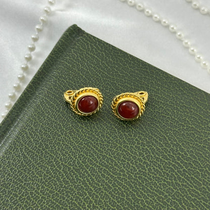 Gold Tone Oval Clip On Earrings with Red Stones