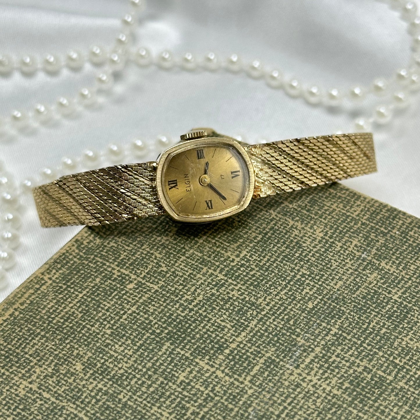 Slender Gold Vintage Wind-Up Elgin Watch with Roman Numeral Markers