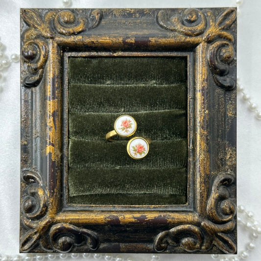 Vintage style gold tone bypass ring with round pink rose painted white enamel cameos.