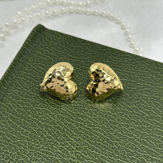 Vintage gold tone heart shaped clip on earrings.