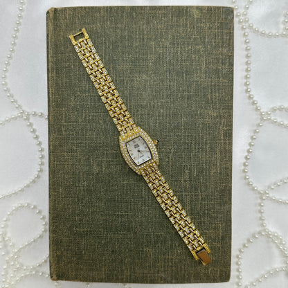 Elegant Crystal Gold Nolan Miller Watch with Mother of Pearl Dial