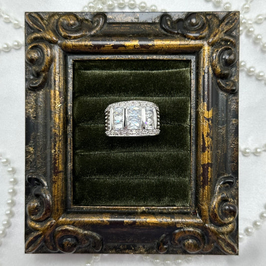 Rhodium plated vintage deadstock band ring with 3 rows of clear cubic zirconia stones.