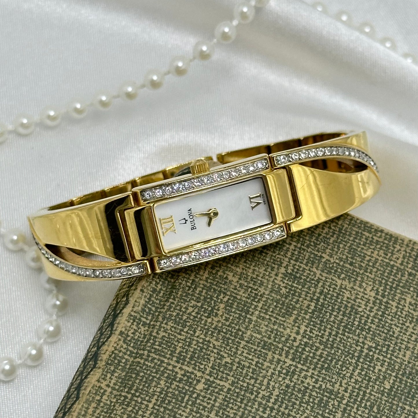 Gold Bulova Watch with Swarovski Crystals and Roman Numeral Markers