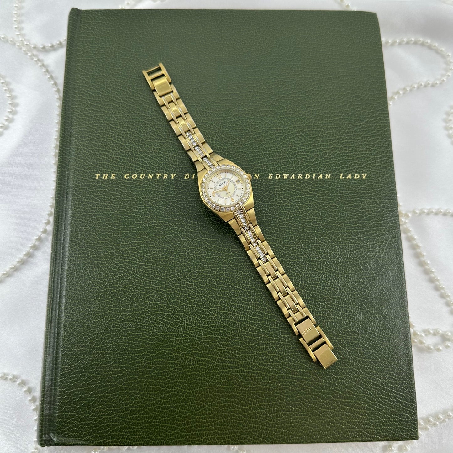 Queen's Court Gold Relic Watch with Crystal Accents and Date Display