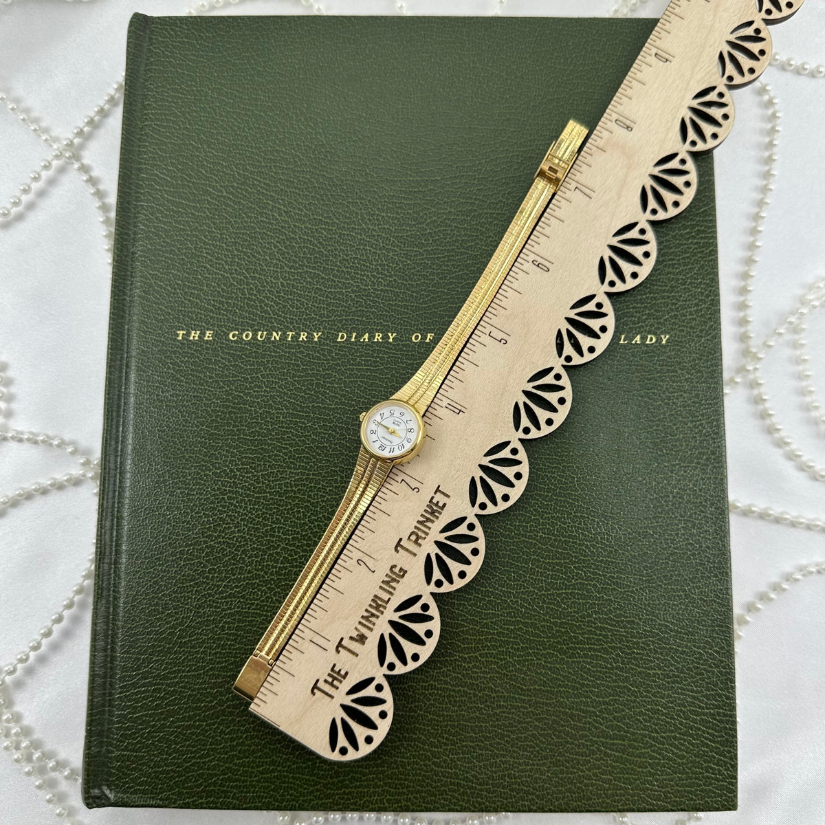Slender Gold Armitron Watch with Round Dial