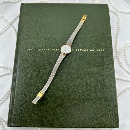 Slender Gold Armitron Watch with Round Dial