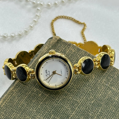 Elegant Round Dial Gold and Black Watch