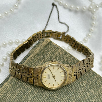Dainty Gold Round Dial Seiko Watch