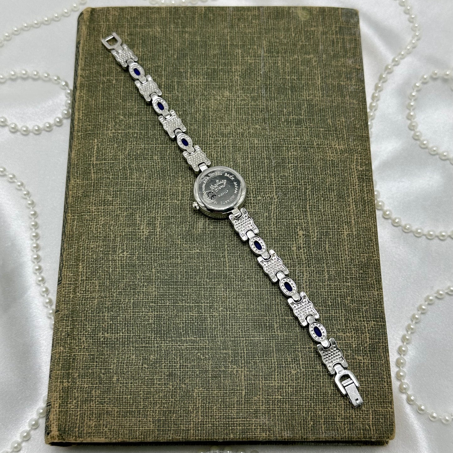 Silver Round Dial Watch with Blue Gemstone Band