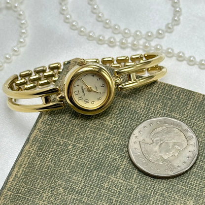 Gold Carriage Cuff Watch