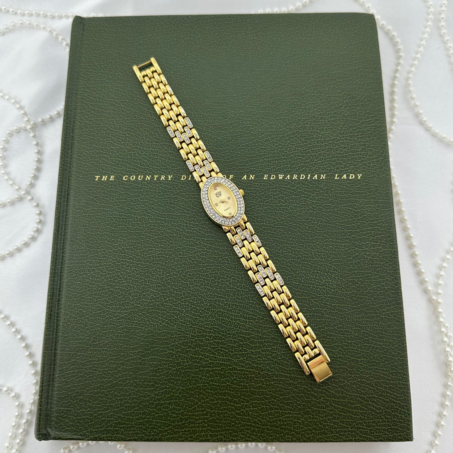 Elizabeth Taylor White Diamanté Gold Watch with Oval Dial