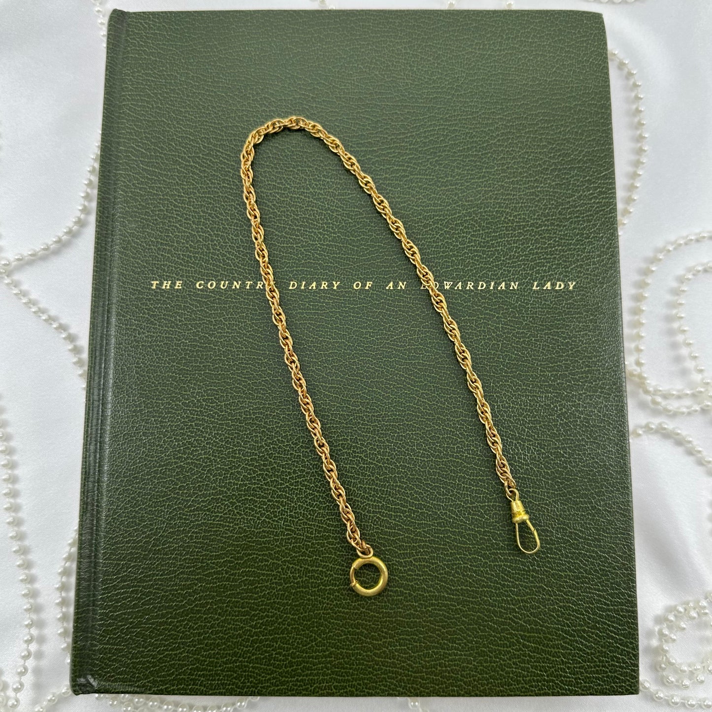 Vintage gold tone twisted metal watch chain with dog clip clasp from the 1960's.