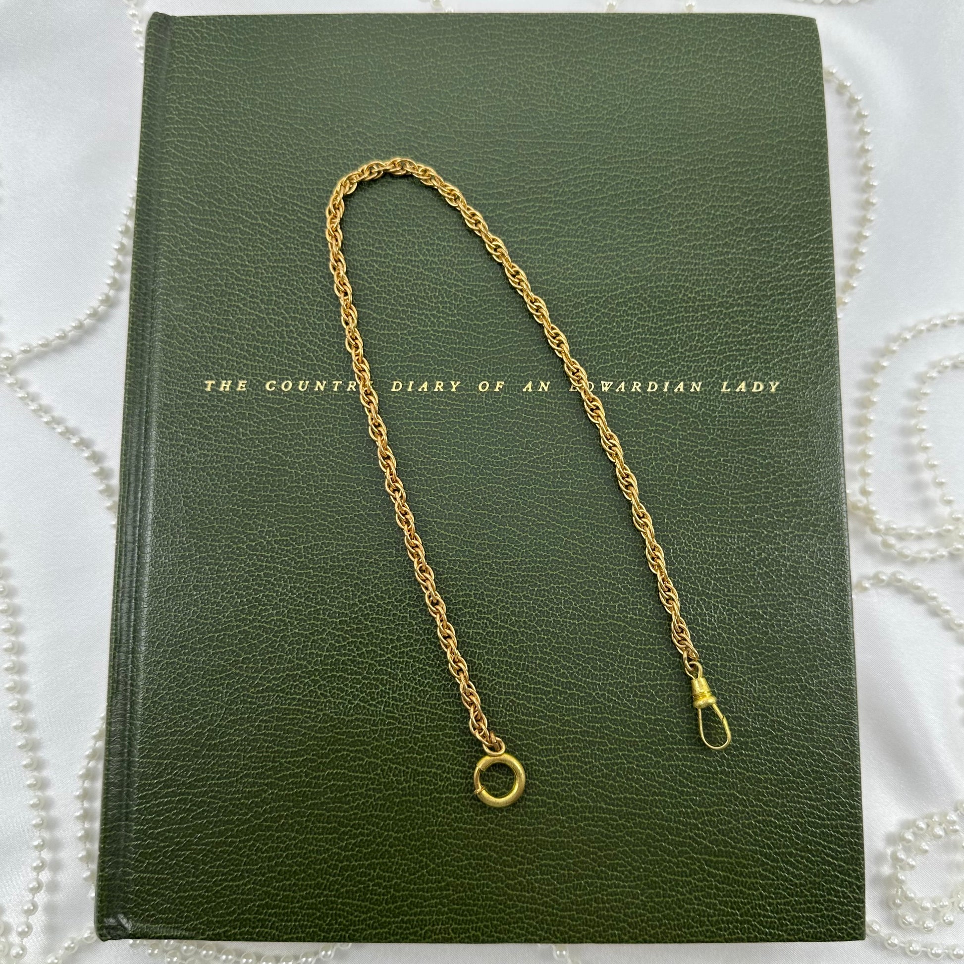 Vintage gold tone twisted metal watch chain with dog clip clasp from the 1960's.