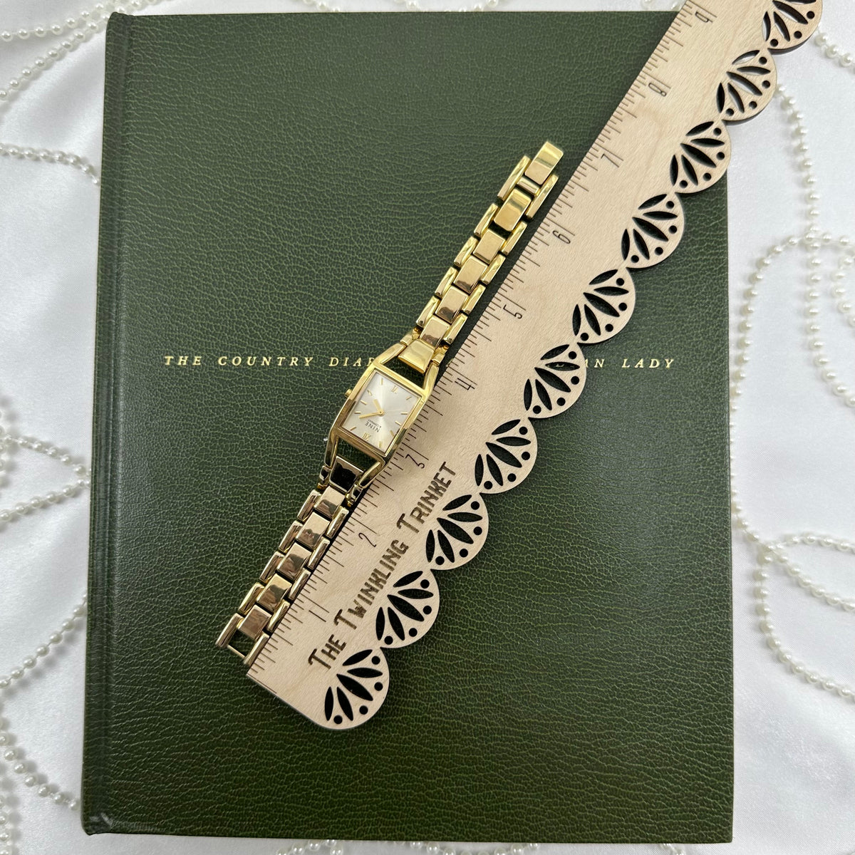 Classic Gold Nine & Company Watch with Rectangular Dial