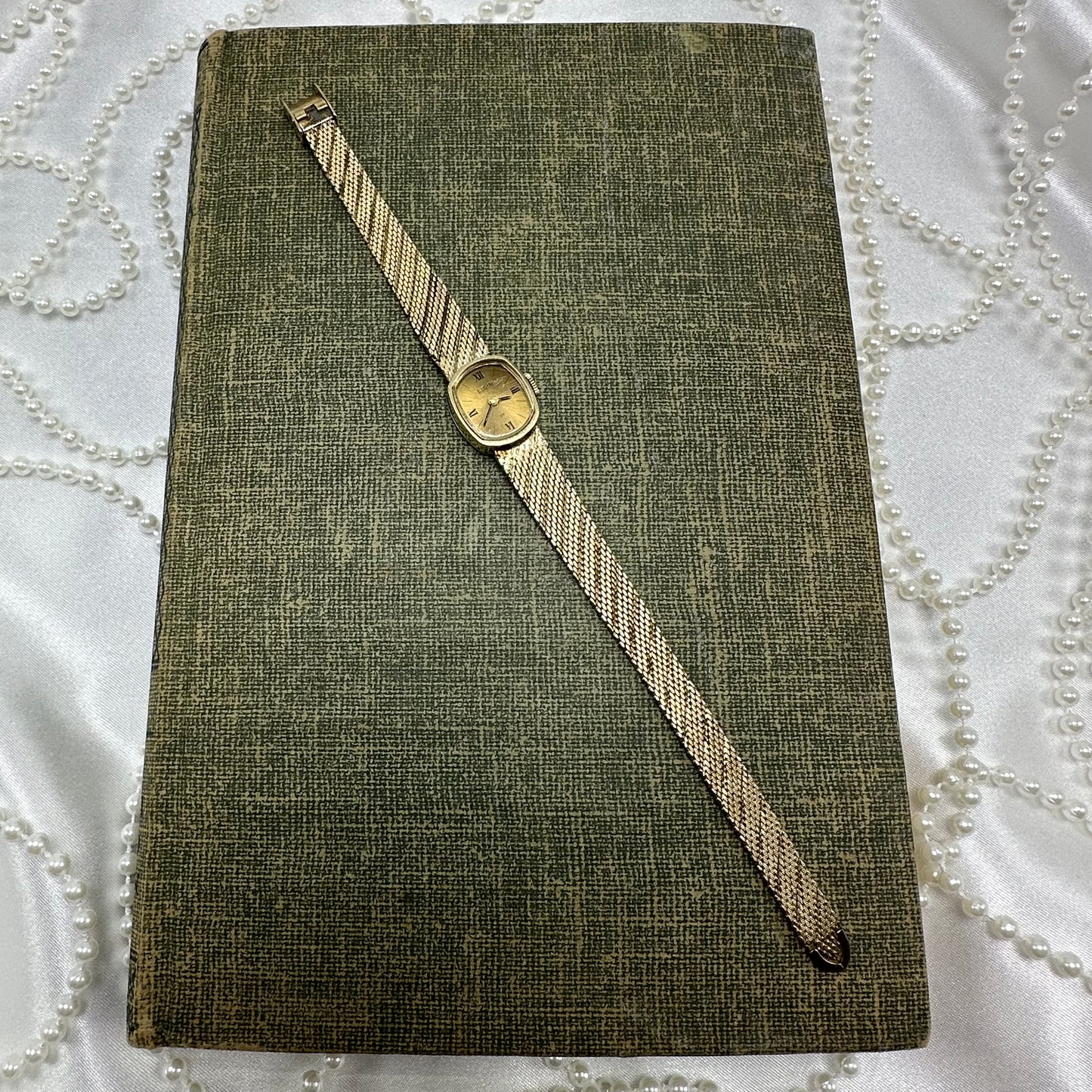 Slender Gold Vintage Wind-Up Elgin Watch with Roman Numeral Markers