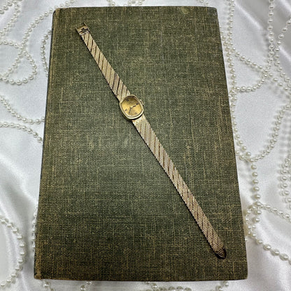 Slender Gold Vintage Wind-Up Elgin Watch with Roman Numeral Markers