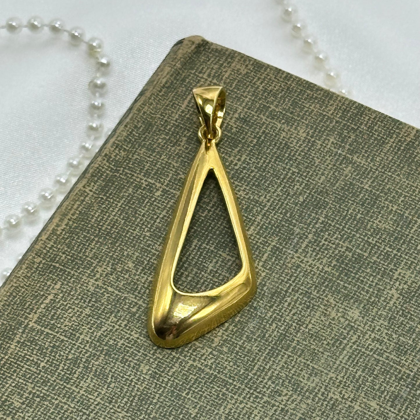 Vintage gold tone charm pendant.