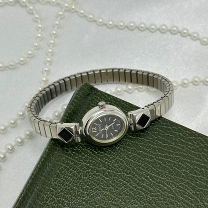 Dainty Silver and Black Oval Dial Rumours Watch