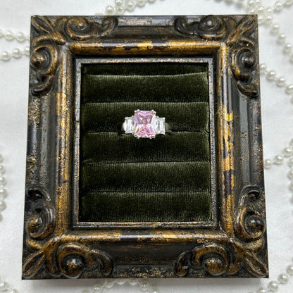 Rhodium plated vintage deadstock ring with large pink square shaped center stone surrounded by cubic zirconia stones