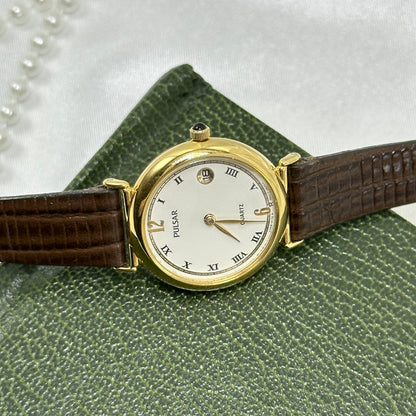 Vintage Gold Pulsar Watch with Brown Leather Band and Date Display