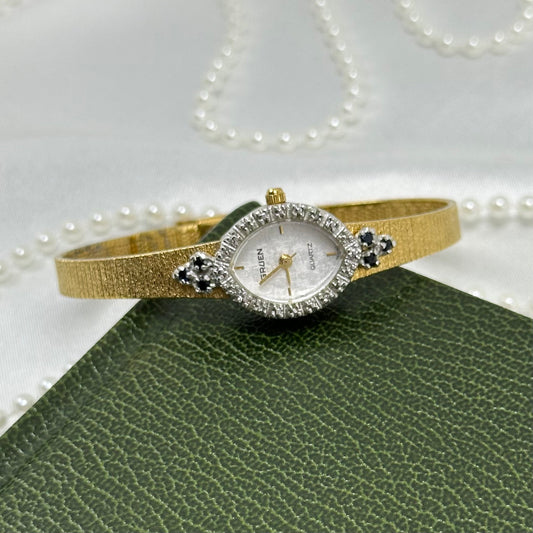 Elegant Gold Gruen Watch with Sapphires and Diamonds