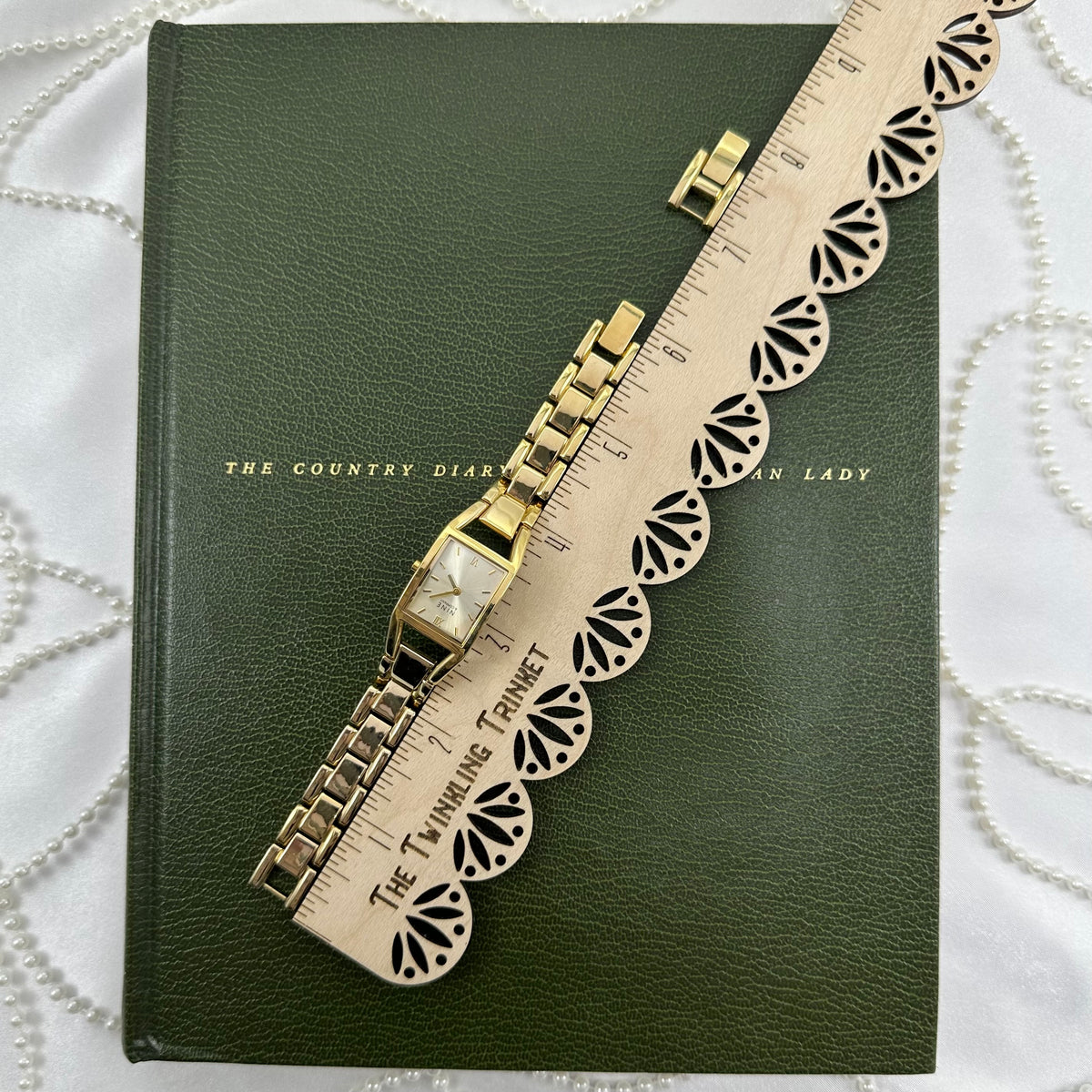 Classic Gold Nine & Company Watch with Rectangular Dial