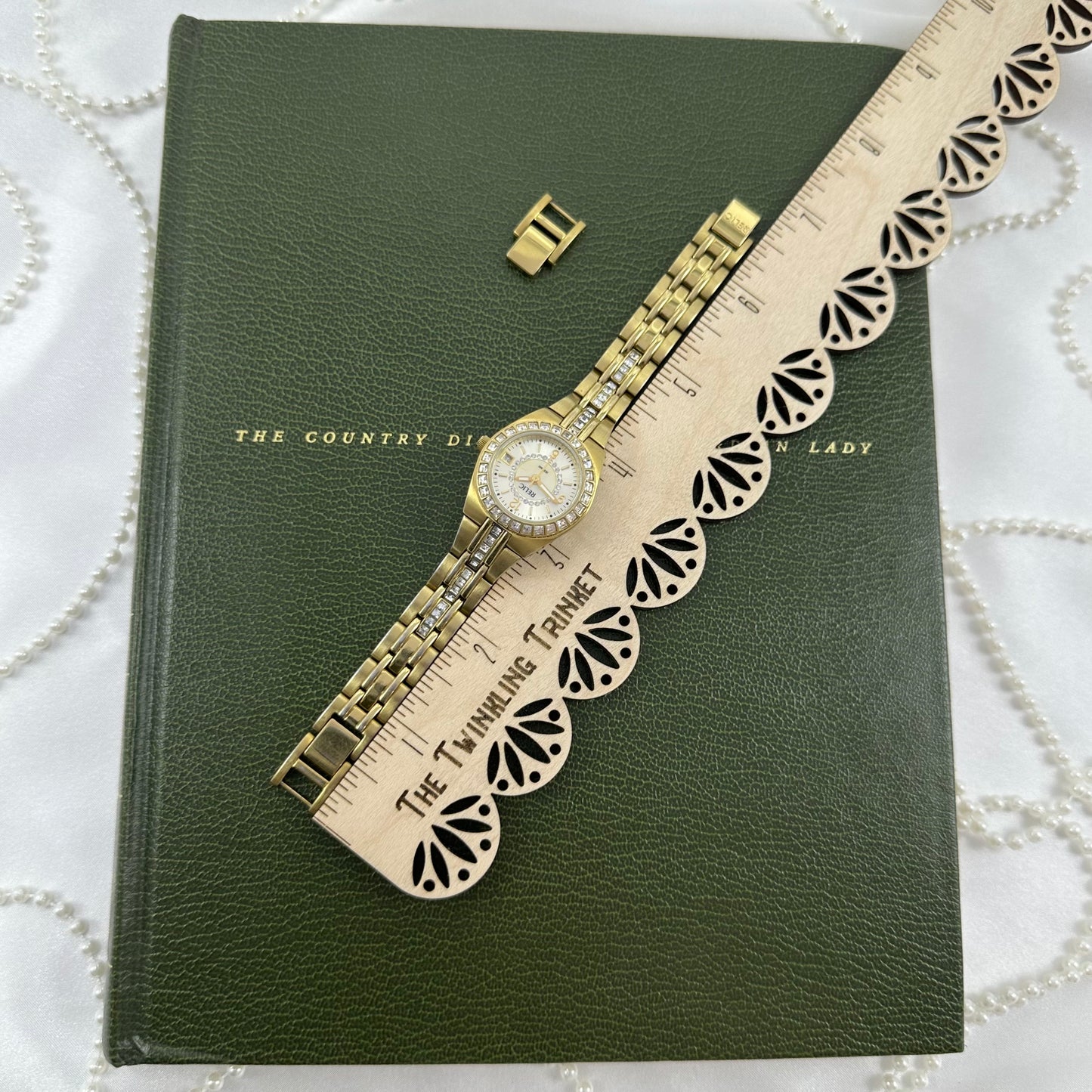 Queen's Court Gold Relic Watch with Crystal Accents and Date Display