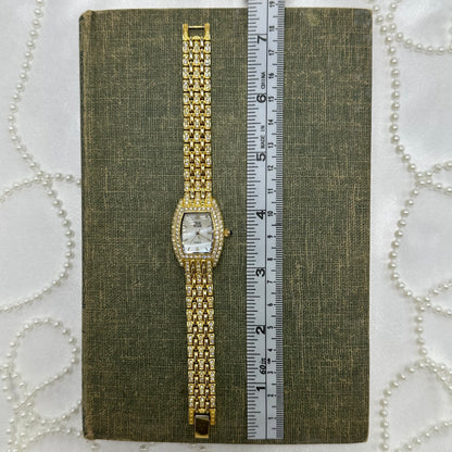 Elegant Crystal Gold Nolan Miller Watch with Mother of Pearl Dial